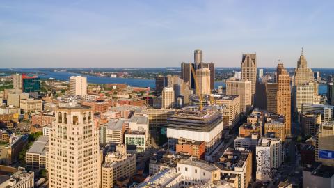 An aerial view of downtown Detroit with the river in the background