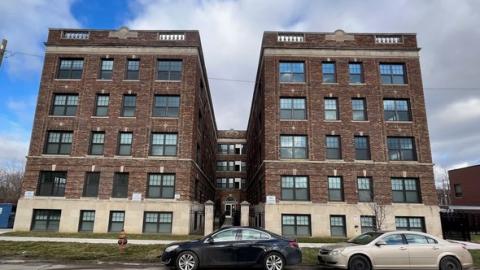 A historic five story brick apartment building