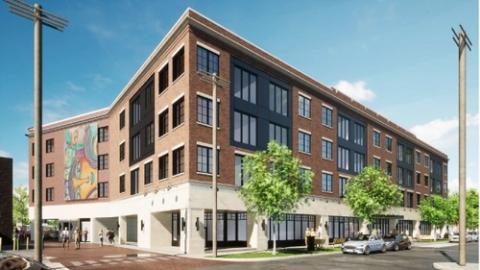 A rendering of a four story apartment building
