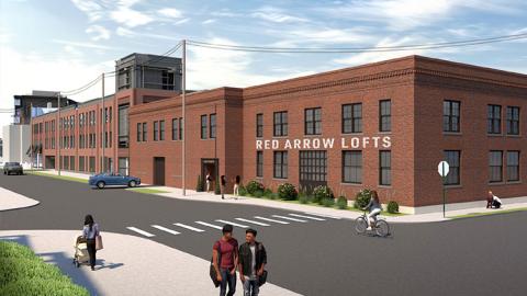 A two-story brick building reused into lofts