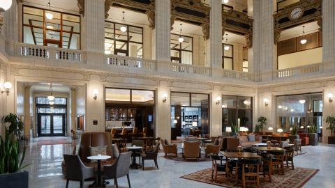 A classic hotel lobby with a three story atrium