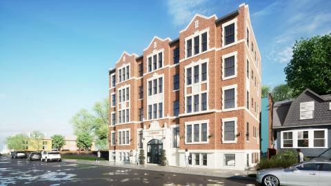 A rendering of a renovated five-story brick apartment building