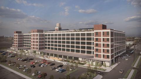 A rendering of a redeveloped six story former auto plant