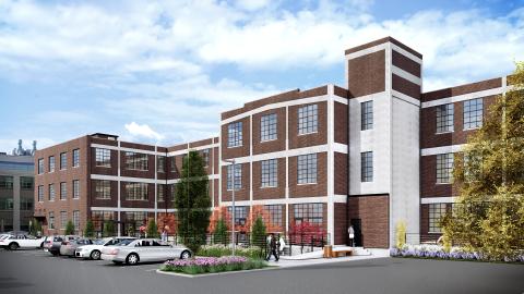 A rendering of a three-story brick building