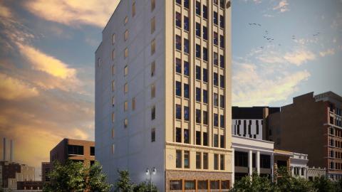 A 10 story building on a downtown street
